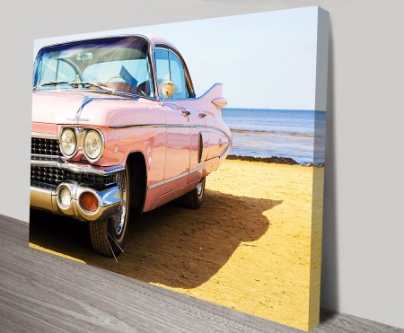 Canvas print of a Cadillac on the beach, warm retro coastal tones for a WA garage bar