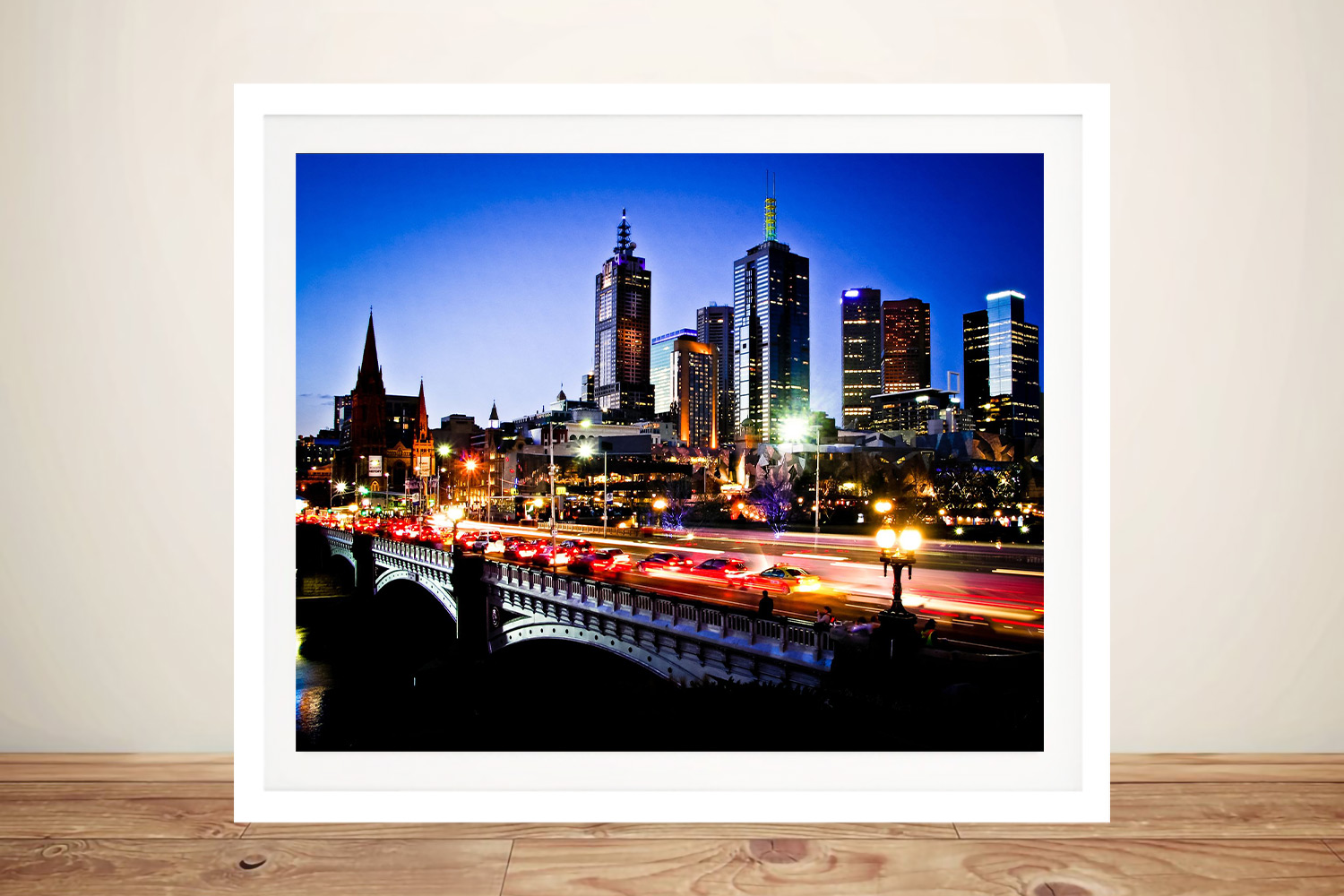 Framed print of the Melbourne skyline at night, moody glowing city tones