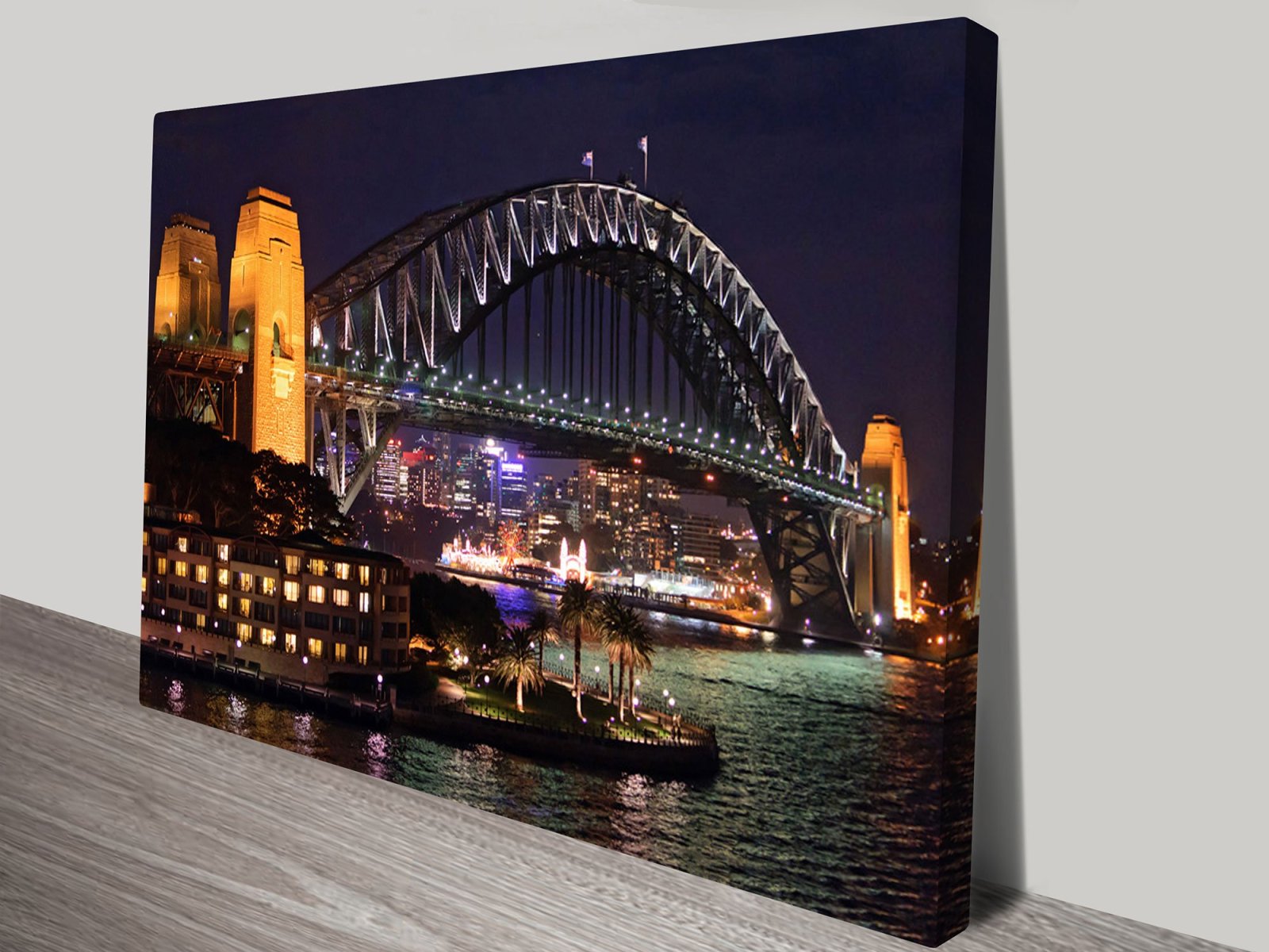 Sydney Harbour Bridge at night with glowing water reflections