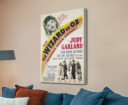 The Wizard of Oz vintage poster canvas with Judy Garland above a Technicolor rainbow banner and the cast line-up