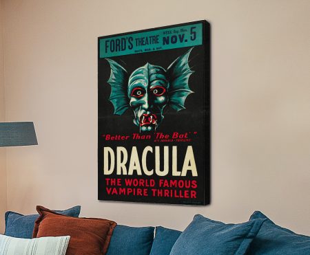 Vintage Dracula film poster with a chilling teal vampire face, bat wings and blood-red eyes
