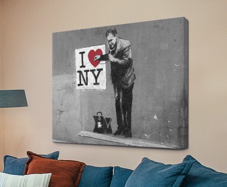 Banksy Love New York street-art with a plastered red heart over NY lettering