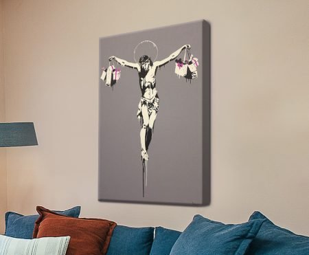 Banksy stencil of Christ on the cross holding shopping bags, satirical street-art canvas print