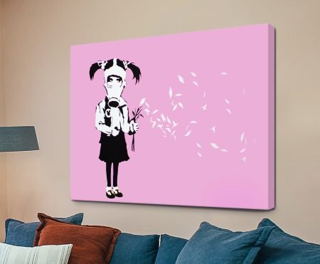 Banksy stencil of a young girl wearing a gas mask set against soft pink, street-art canvas