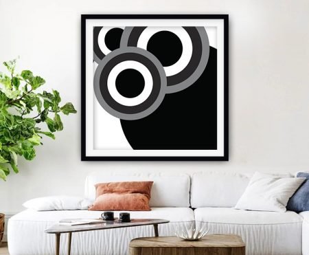 Framed black and white print of repeating retro circles