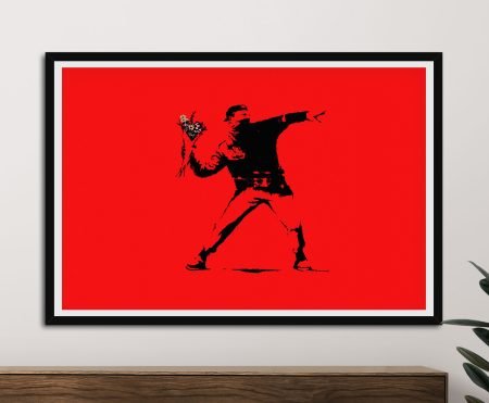 Flower Thrower by Banksy, a masked figure hurling red blooms against grey stencil.