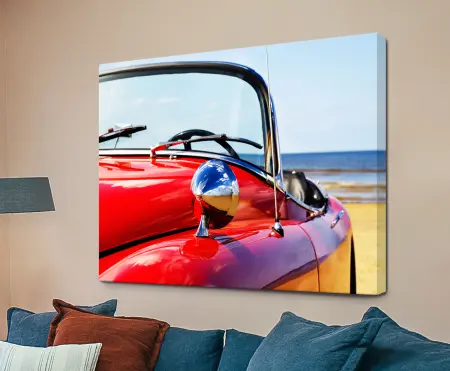Red classic car on a beach, canvas print