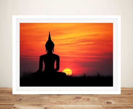 White-framed contemporary art print Buddha Statue at Sunset propped on a timber floor against a soft wall
