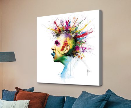 Profile portrait of Jean Paul Gaultier with a mohawk exploding into red, yellow, purple and blue paint splatters