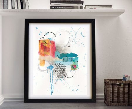 Abstract Skyline I by Courtney Prahl framed print with blue, orange and pink watercolour splashes leaning against white wall