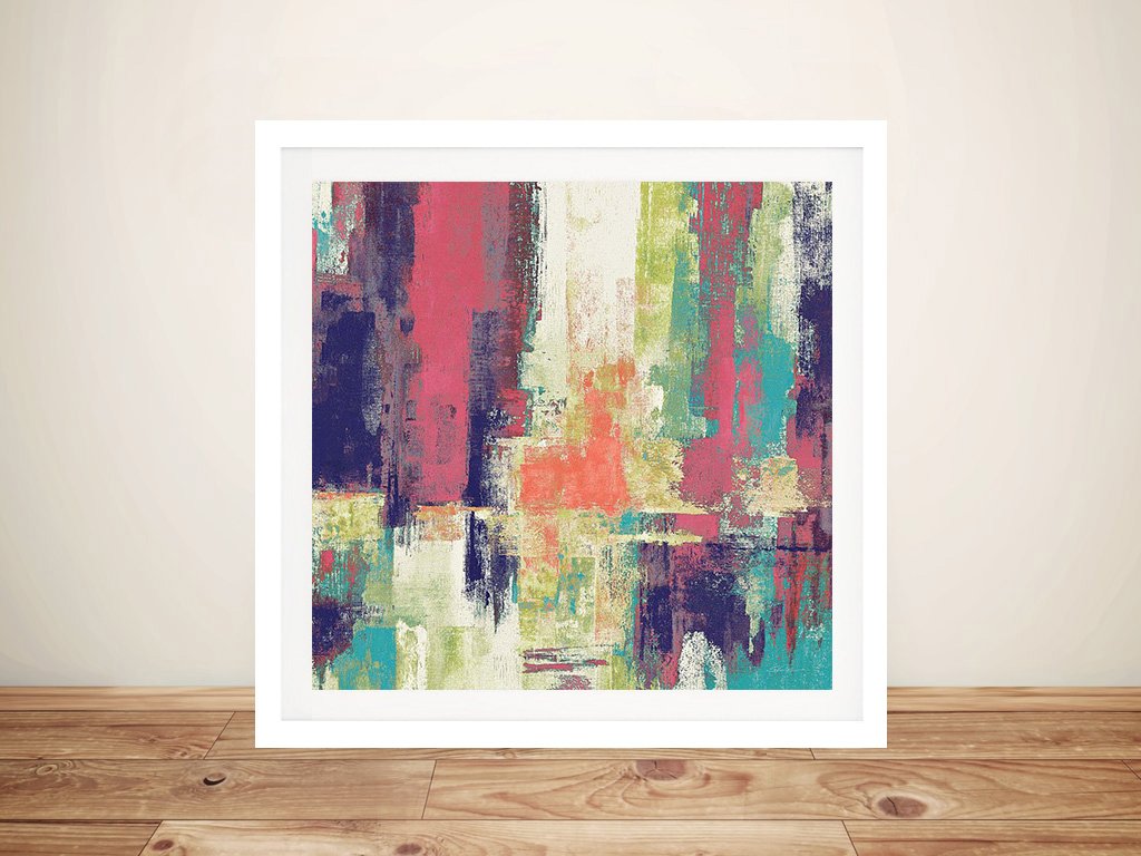 Castanets by Silvia Vassileva framed abstract print with pink, teal, navy and lime brushstrokes leaning against a cream wall