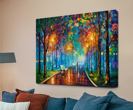 Misty Mood palette knife painting of a couple under an umbrella on a glowing tree-lined path as a canvas above a blue sofa