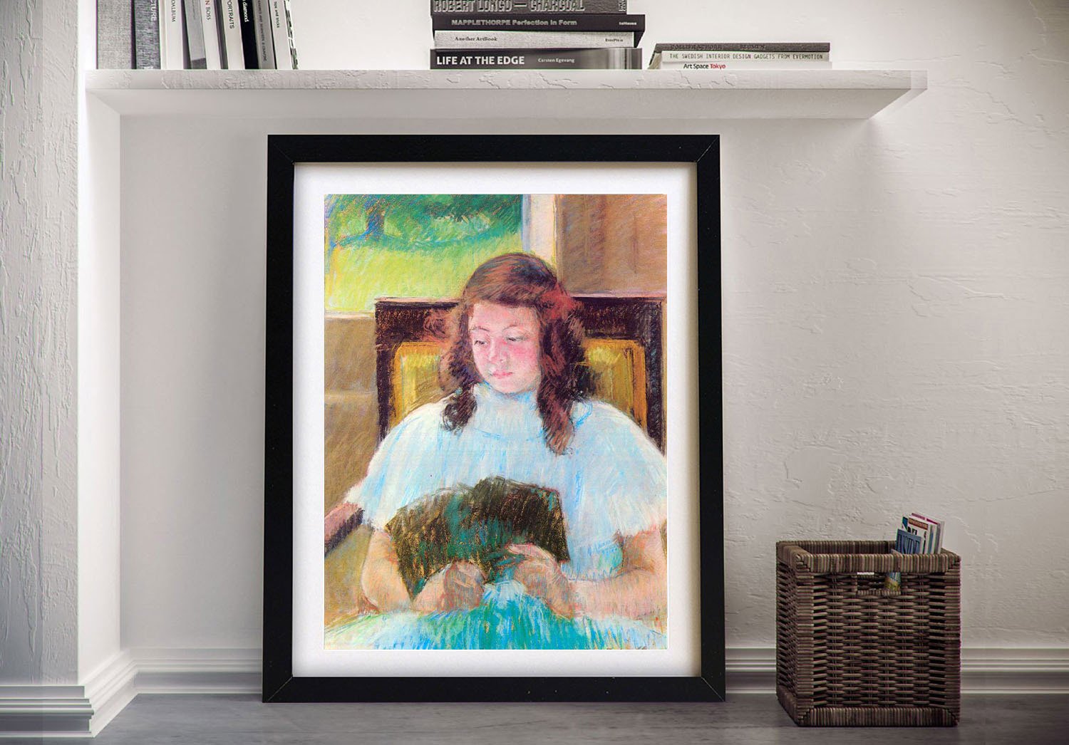 Framed print of Young Girl Reading by Mary Cassatt, soft warm tones