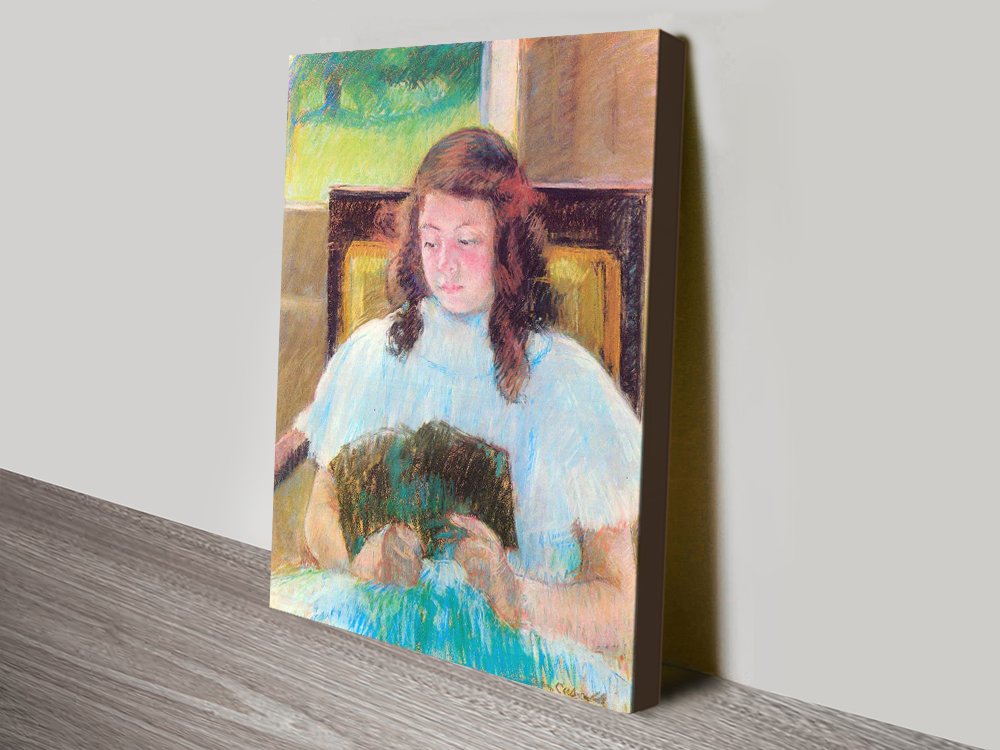 Canvas of Young Girl Reading by Mary Cassatt, soft warm domestic tones