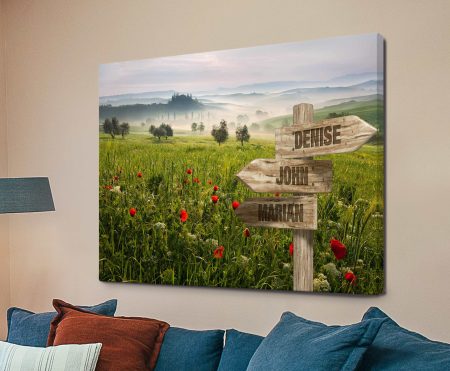 Personalised wooden signpost amid a vivid flower field, canvas keepsake