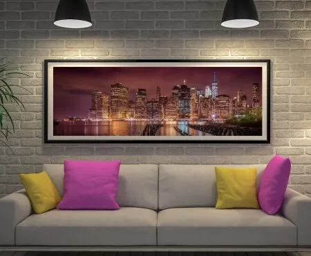 Framed New York panoramic canvas glowing with nightly city lights