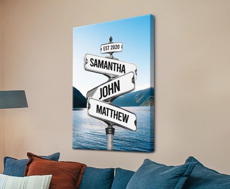 Personalised wooden signpost beside a serene lake, custom canvas keepsake