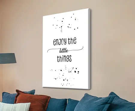 Hand-lettered 'Enjoy the little things' quote in soft neutral tones as canvas wall art