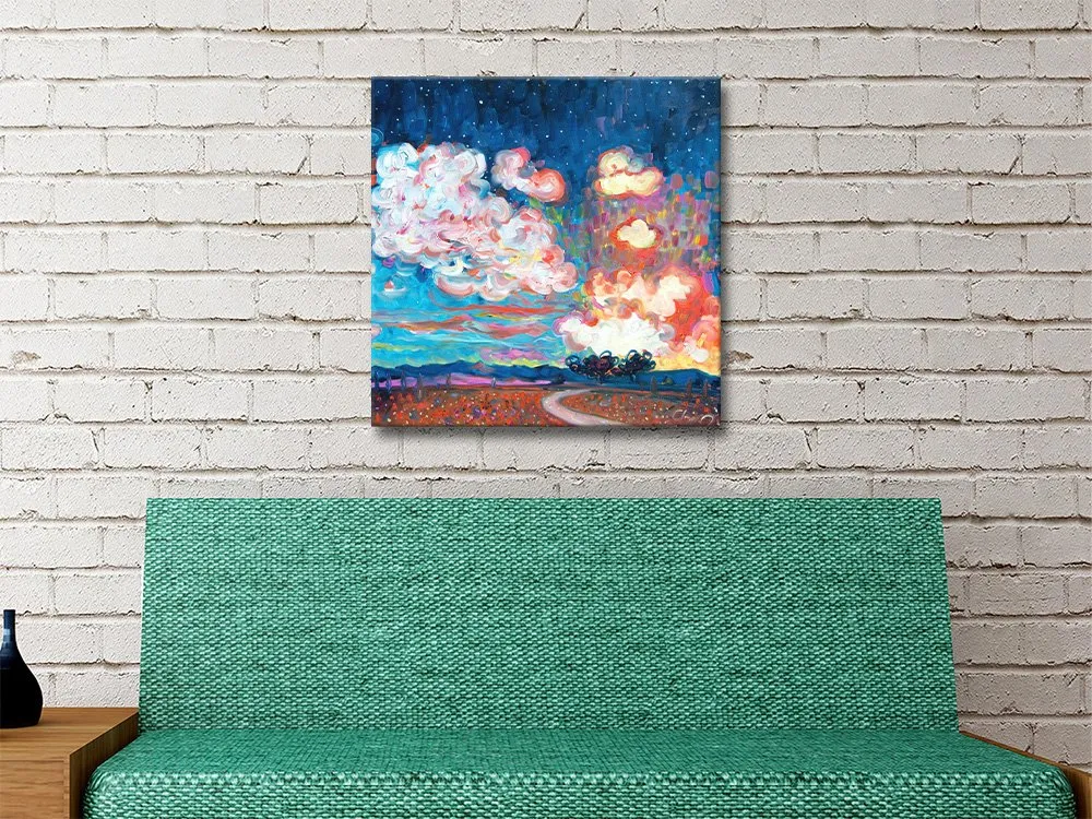 Tequila Sunset by Chiara Magni square canvas print featuring vibrant pink clouds and starry blue sky above green sofa on whitewashed brick wall
