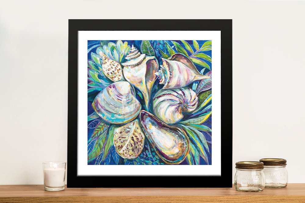 Framed print of Tropical seashells cluster on deep blue in a black frame
