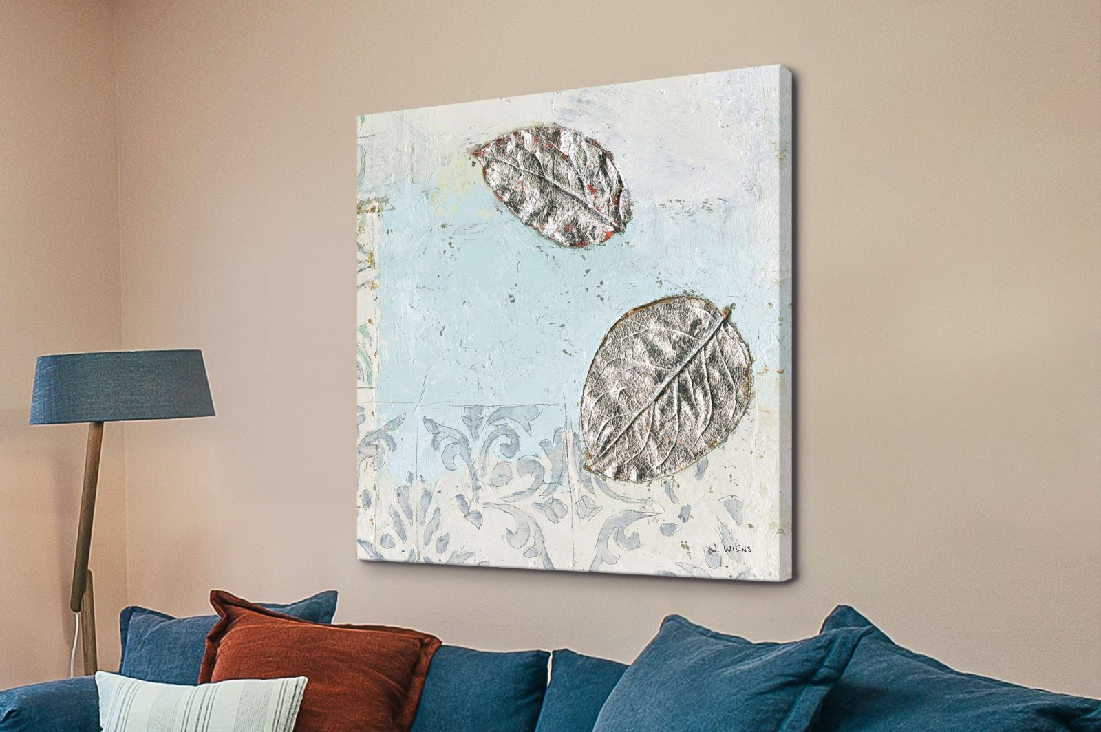 James Wiens Gracefully Blue II square canvas with silver leaves on pale blue damask, hung above a navy sofa