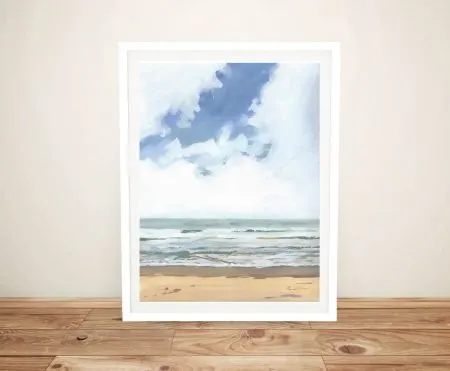 Walk on the Beach I framed coastal seascape with soft blue sky, drifting clouds and gentle waves over golden sand