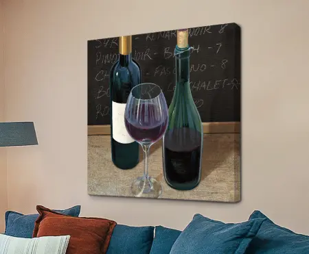 Wine Spirit III by James Wiens, a still life of two wine bottles and a glass of red against a chalkboard wine list