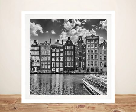 Framed monochrome print of the Damrak canal and Dancing Houses in Amsterdam