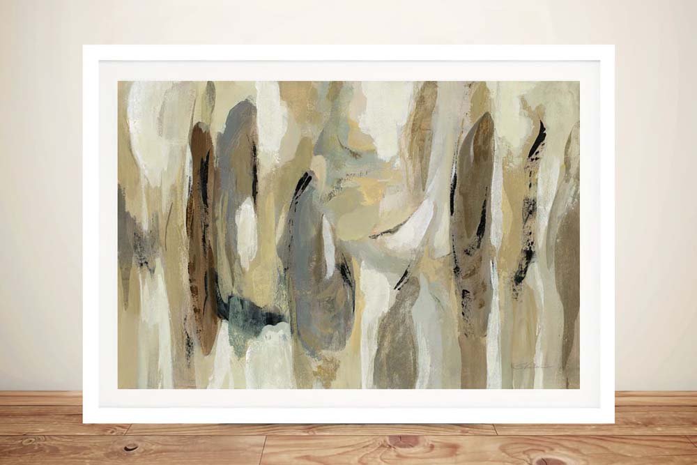 Fluidity Neutral by Silvia Vassileva framed abstract print with beige, grey and brown brushstrokes leaning against a cream wall