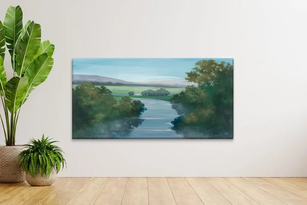 Wide panoramic landscape canvas print mounted as the focal piece behind a corporate reception desk