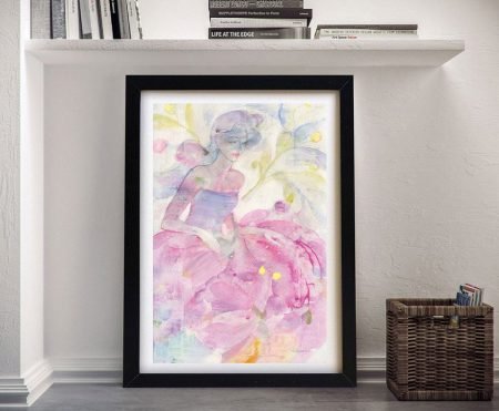 Framed watercolour dancer in soft pink and lavender tones leaning against a white wall