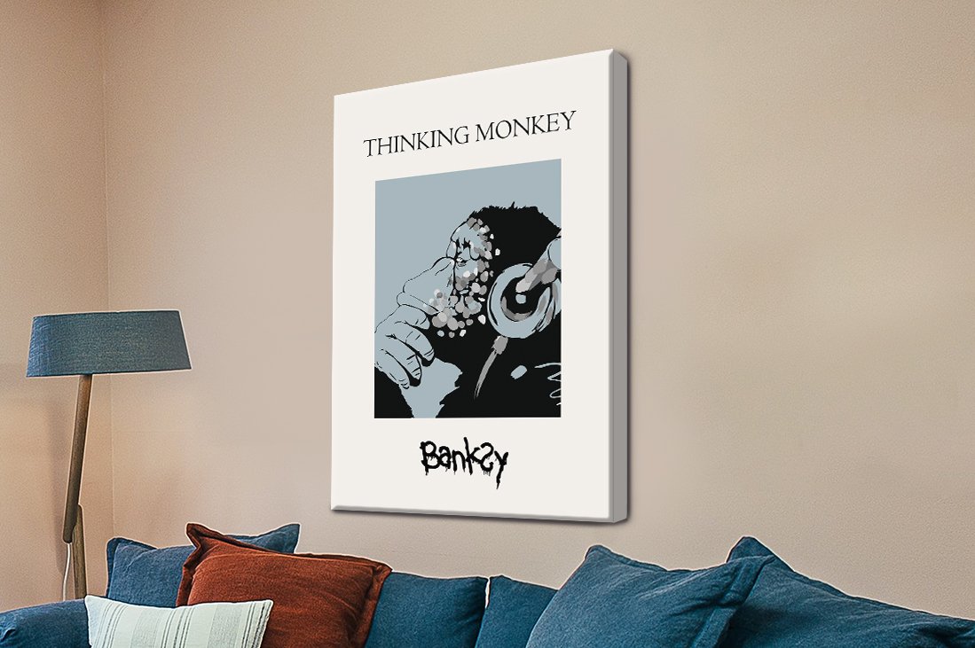 Banksy DJ Monkey stencil spinning records on a cool blue background.