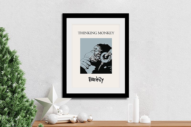 Framed Banksy stencil of a monkey in a contemplative pose