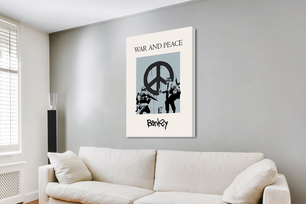 Banksy soldiers painting a peace sign on canvas