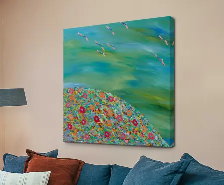 Planet of Odina by Helen Joynson square canvas print showing colourful floral hilltop and birds in turquoise sky above blue sofa