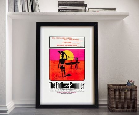 The Endless Summer framed movie poster, silhouetted surfers against a pink and orange sunset