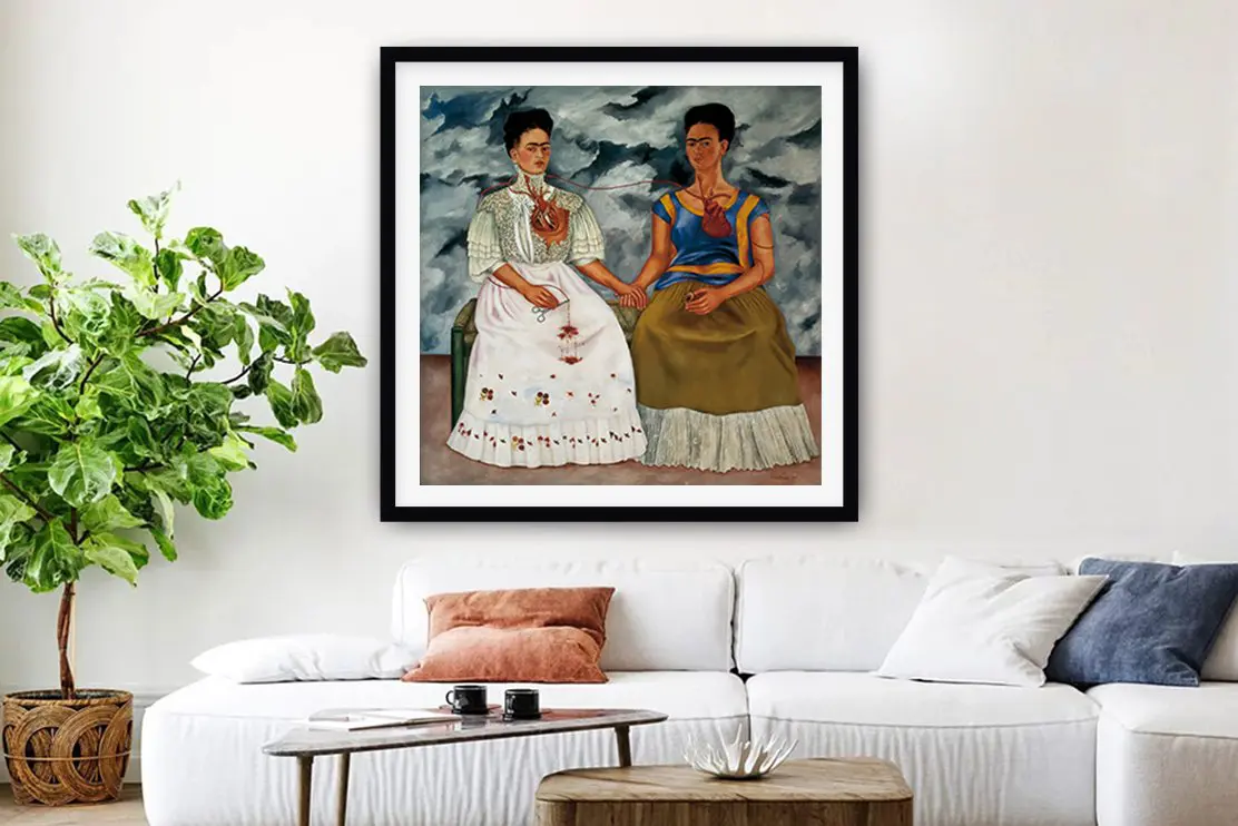 Frida Kahlo's The Two Fridas surrealist double portrait in a black frame