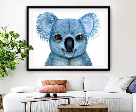 Framed print of a painted blue baby koala with large brown eyes and feathery ears on a white background