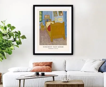 Framed print of Van Gogh's Bedroom in Arles in yellows, blues and timber tones