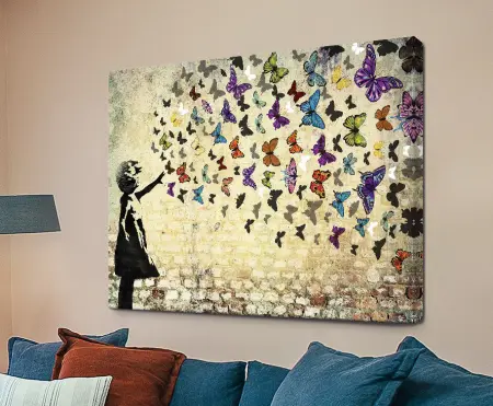 Banksy Butterfly Girl graffiti stencil of a child with colourful butterflies
