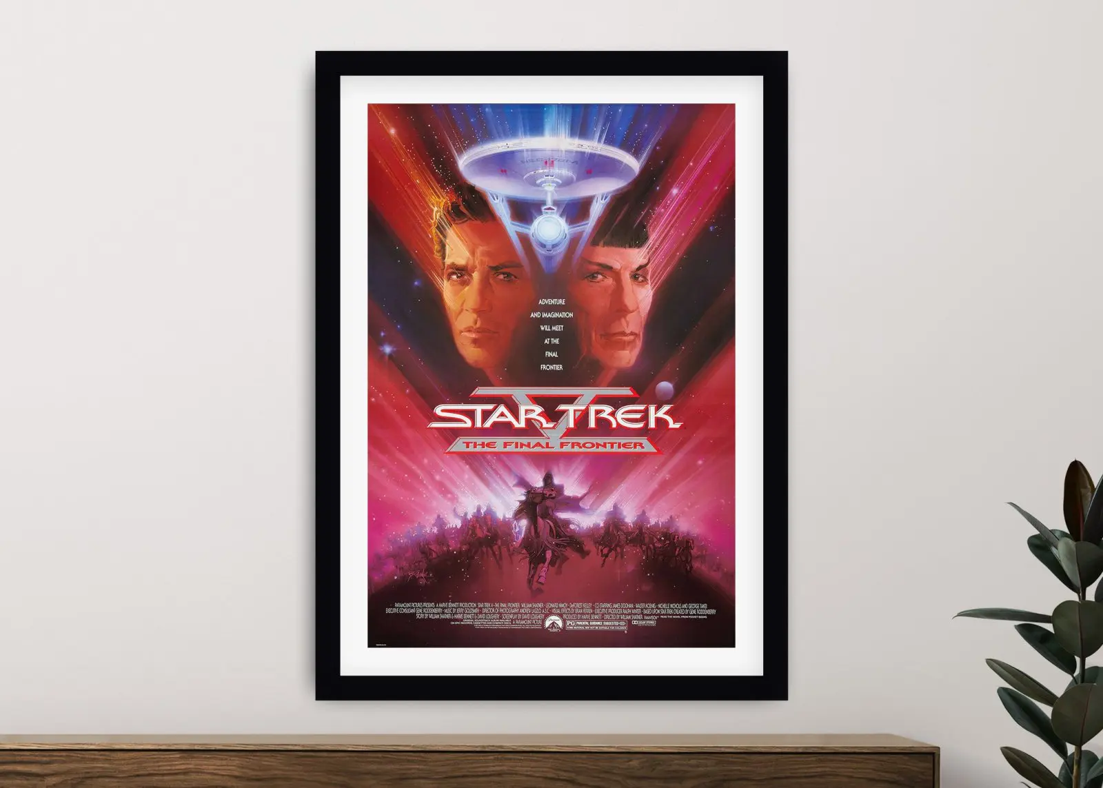 Close-up of the Star Trek V The Final Frontier framed print with the Enterprise streaking through pink space above Kirk and Spock