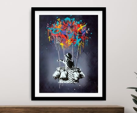 Banksy Hot Air Balloon Boy print in a black frame with a red balloon accent