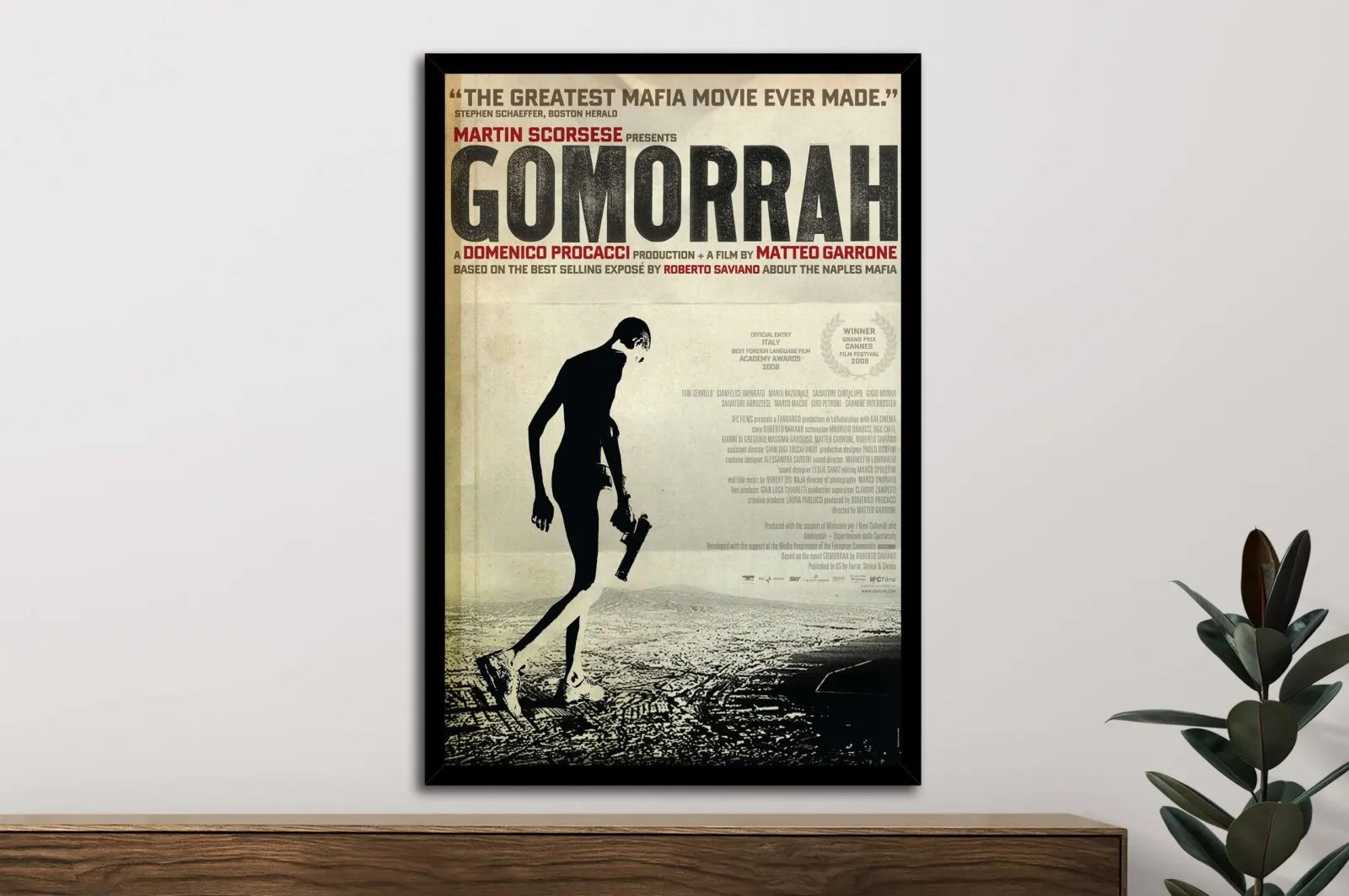 Framed Gomorrah poster, gritty grey and shadow tones of a raw Italian crime drama