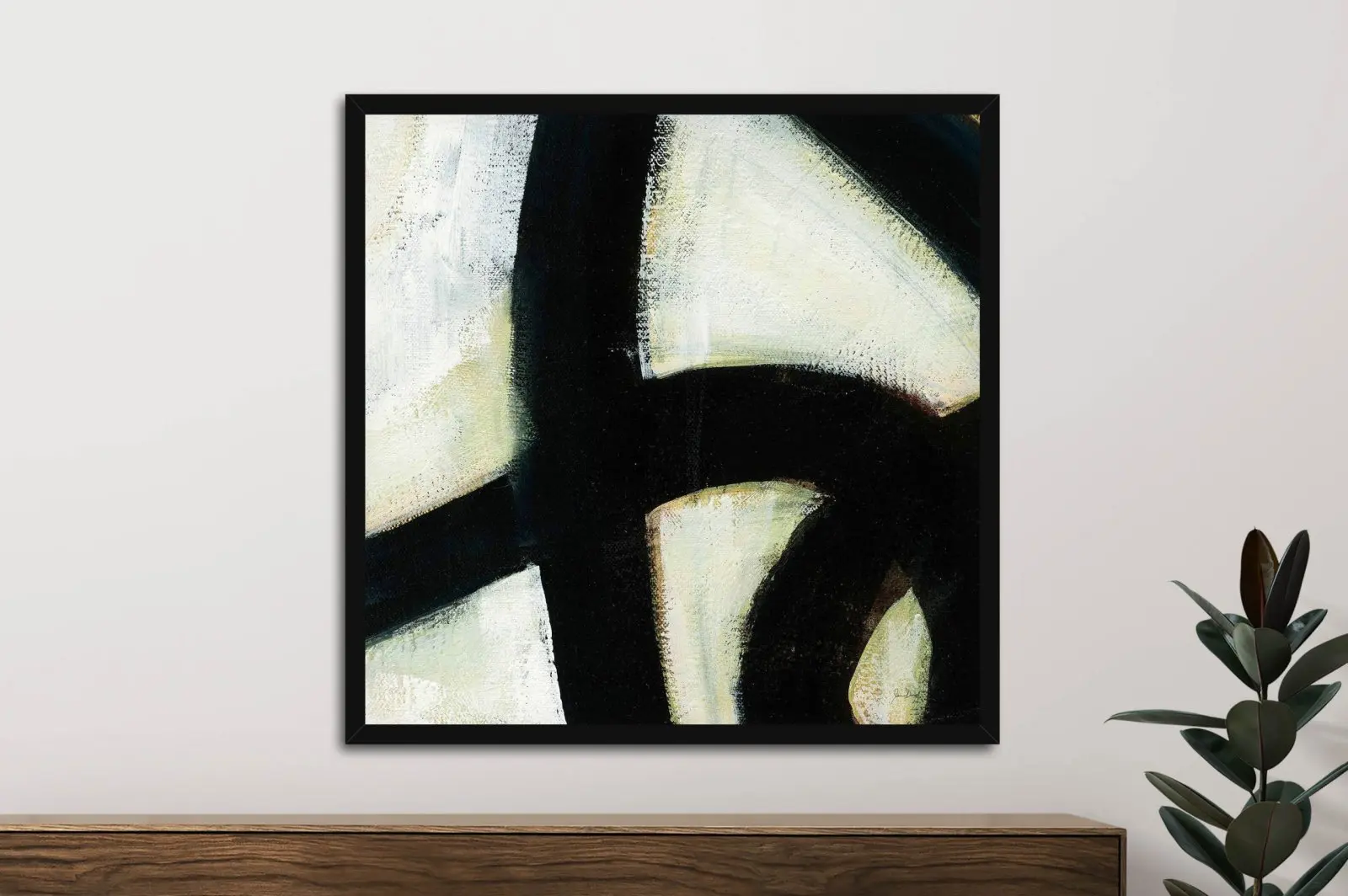 In the Maze I by Jane Davies framed print with bold black brushstrokes on cream above timber sideboard