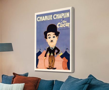 Charlie Chaplin The Circus vintage movie poster on stretched canvas above a denim navy lounge with rust cushions
