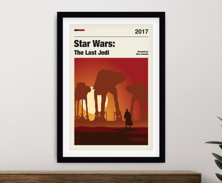 Star Wars The Last Jedi minimalist movie poster framed in black above a timber sideboard with rubber plant