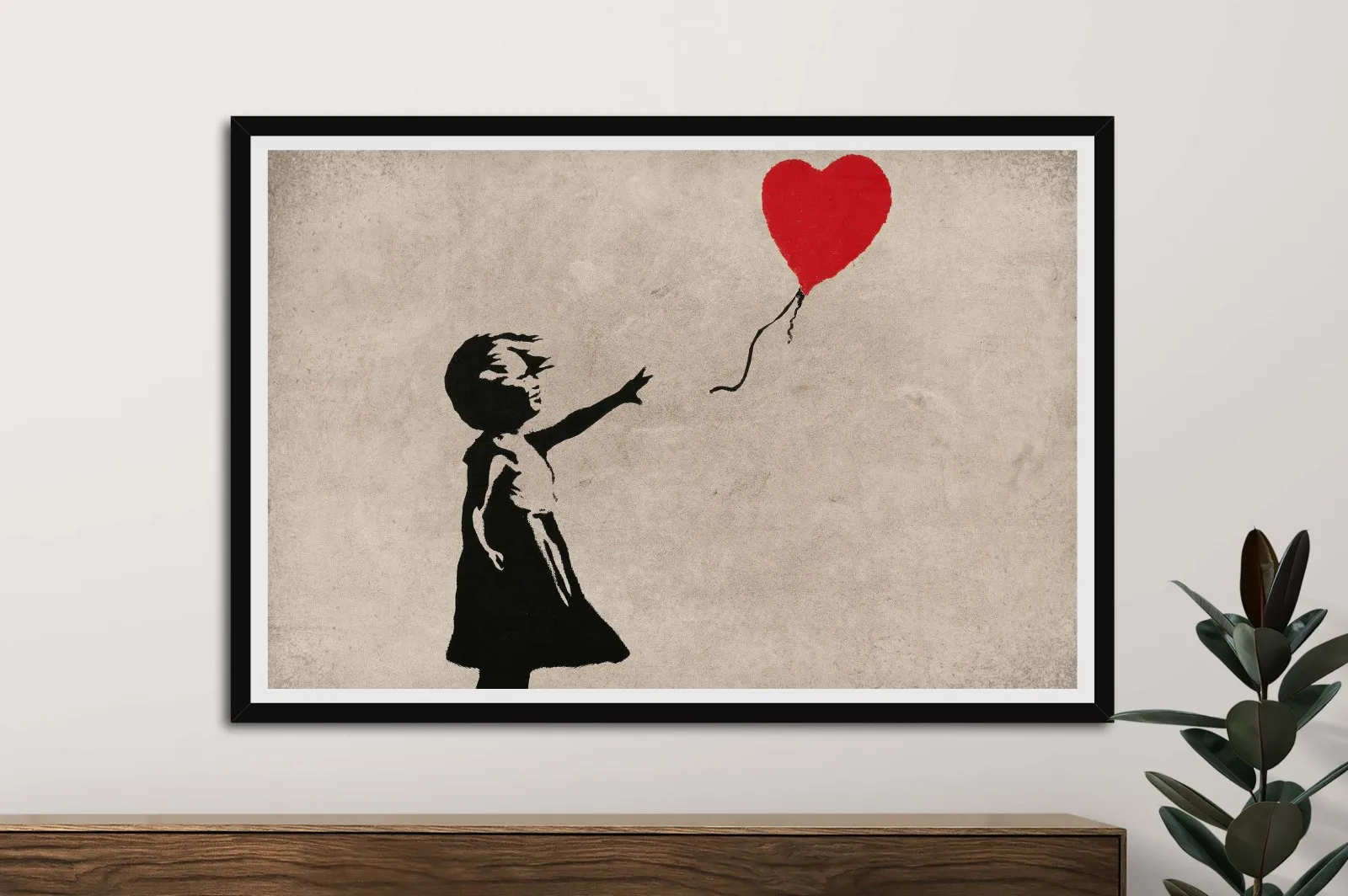 Framed print of Banksy Balloon Girl, tender urban mood for a Perth study