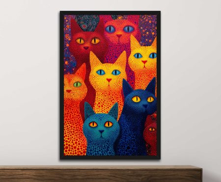 Cats animal art print of stylised pop-art felines in red yellow and blue dot patterns framed in black above a dark timber console
