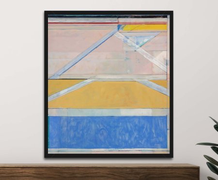 A framed canvas print of Richard Diebenkorn’s Ocean Park No. 24 showing layered geometric shapes in yellow, blue and pale pink, arranged with a calm architectural balance.